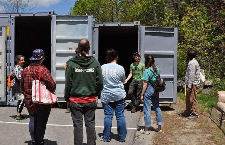 PLAN director Alex Freid with guests at the Artist Dumpster Dive in Durham, NH.