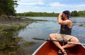 A volunteer searches for debris in Great Bay in New Hampshire.